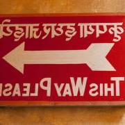 Red exit sign in Hindi and English