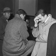 Basketball players, arrested for bribery in 1951, at a police station